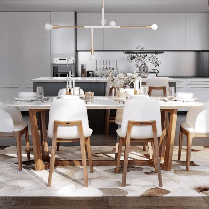 Rear Facing View of Two Aubrey Side Chairs in Alesund Fabric and Walnut Wood Finish in Front of a Dining Table