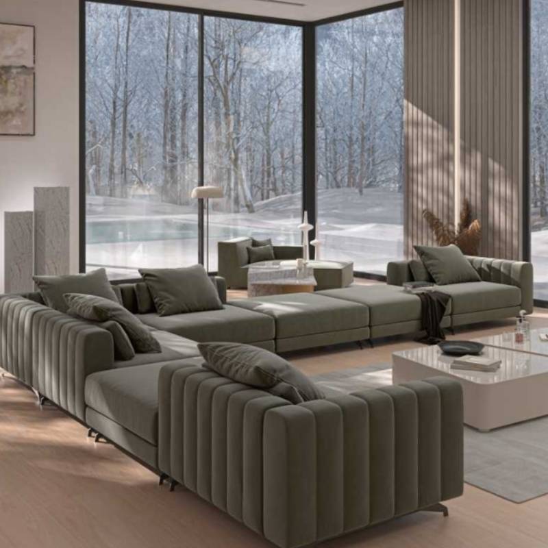 The Berlin Corner Modular Piece on the Right Side of a Sectional in Moonstone Fabric in a Living Room