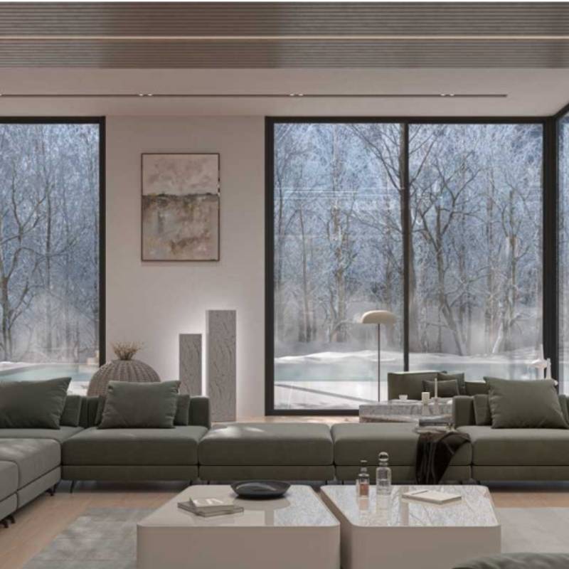 The Berlin Sectional Sofa in Moonstone Color and Fabric in a Living Room With Snow Backdrop