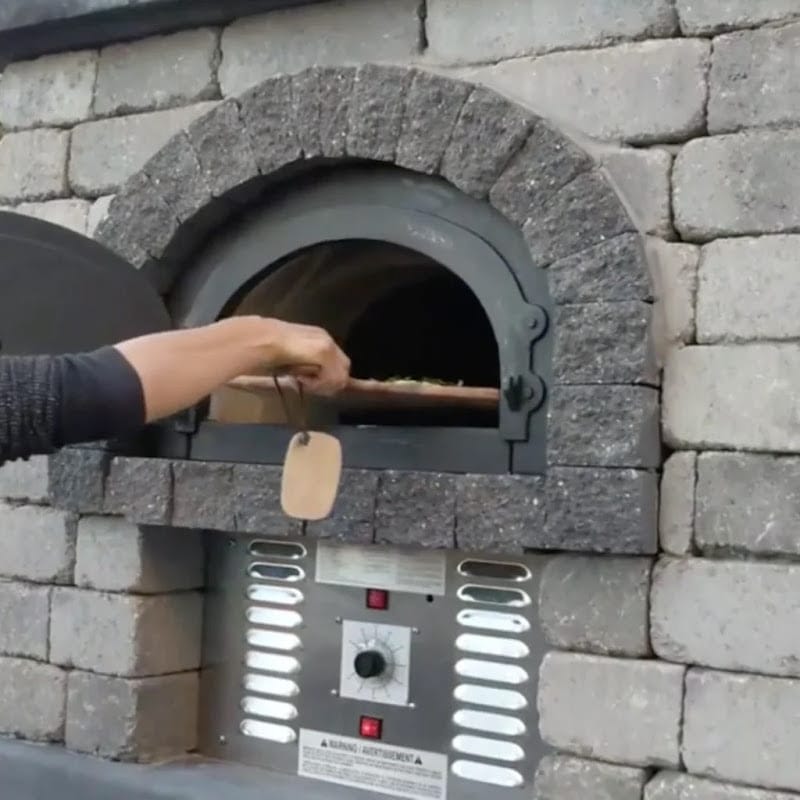 Pizza Placed In A Chicago Brick Oven CBO-750 Hybrid DIY Pizza Oven Dome