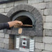 Pizza Placed In A Chicago Brick Oven CBO-750 Hybrid DIY Pizza Oven Dome 