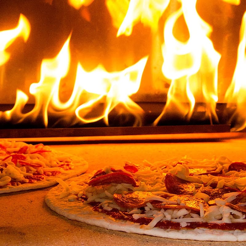 Pizza Cooking in a Chicago Brick Oven 