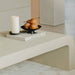 Close Up View of The Cascadia Coffee Table With Alabaster Concrete Surface in a Living Room