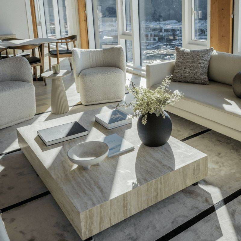 Side Table in Between Two Diane Lounge Chairs in Pearl Fabric in a Living Room