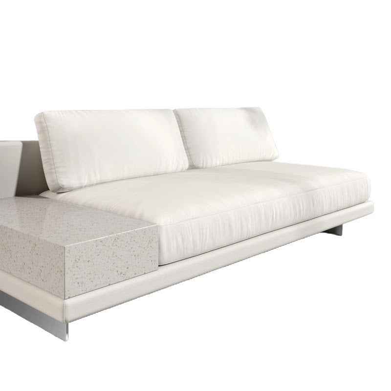 Angled View of the Dresden Outdoor Armless Sofa with Side Table in Palisades Color and White Terrazzo Table