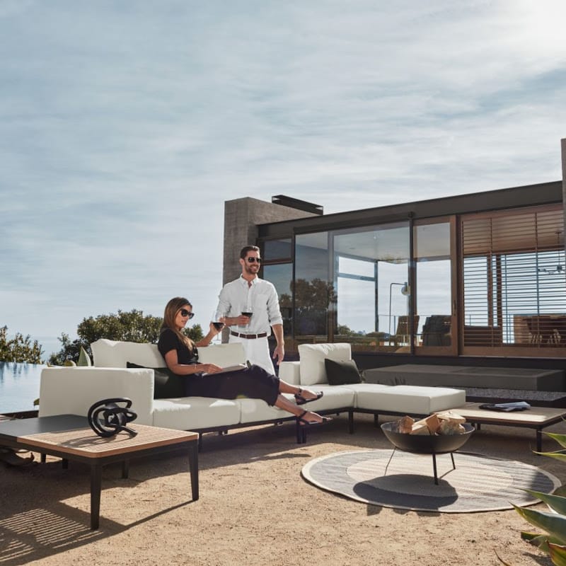 Couple Sitting on a Francis Sectional Sofa Next To a Francis Outdoor Rectangular Coffee Table