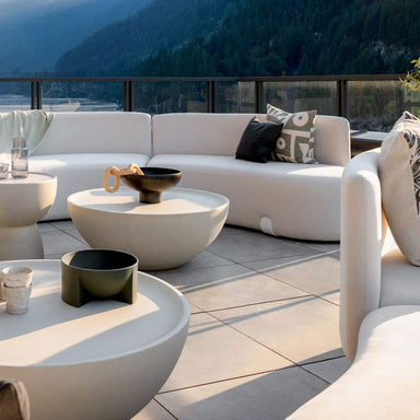 Two Galen Coffee Tables In Alabaster Concrete on a Patio