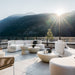 Two Alabaster Concrete Galen Coffee Tables On a Patio In Between Two Couches