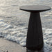 Gallus Side Table In Black Concrete On The Beach