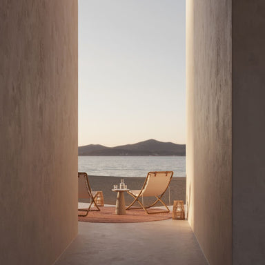 Two Jericho Sling Chairs At The End of and Outdoor Hallway Overlooking the Lake