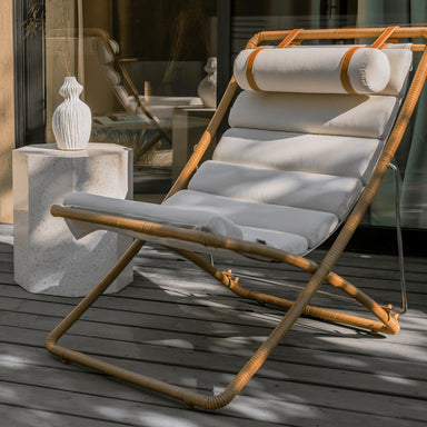 Angled View Of The Jericho Sling Chair In Palisades Color On a Deck