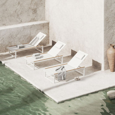 Three White Linnea Outdoor Loungers In White By The Pool