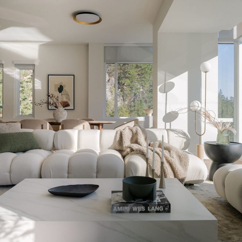 Liza Coffee Table With White Calacatta Ceramic Surface In a Living Room With Dining Table In Background