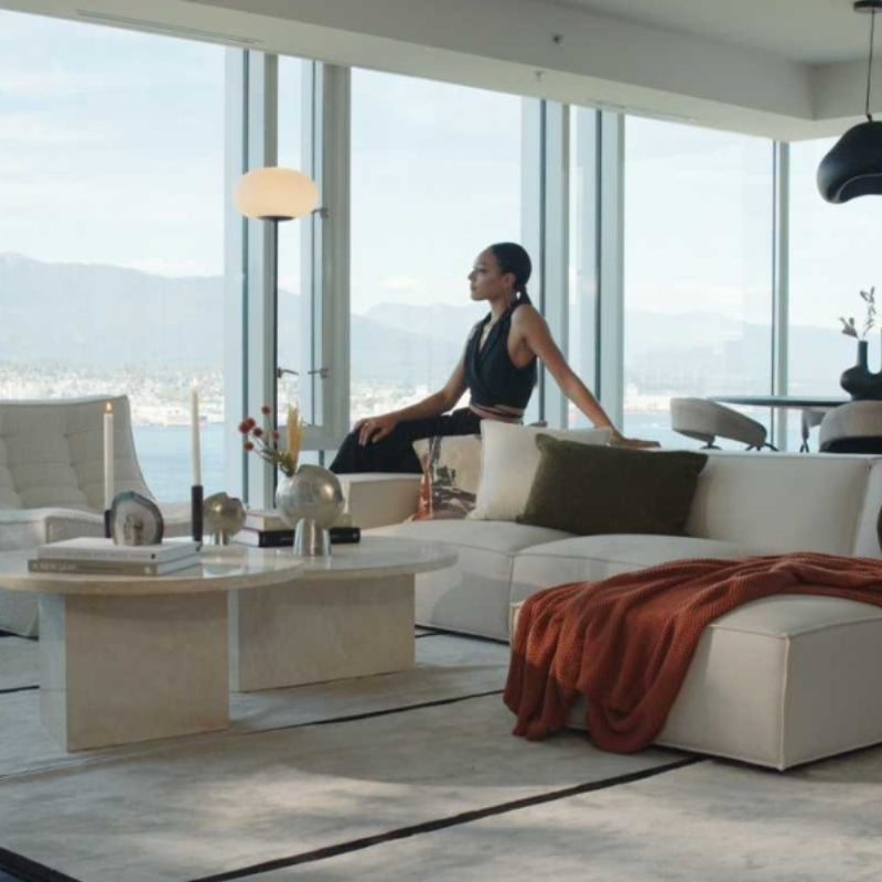 Woman Sitting on The Porter Sectional Right Hand Sofa in a Living Room