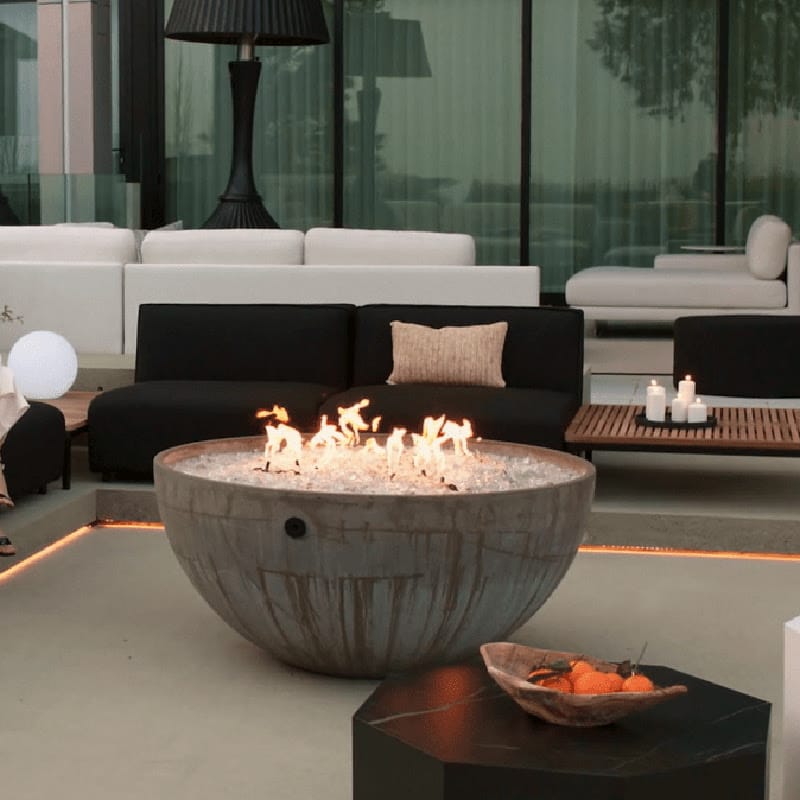 Leia Coffee Table With Black Pietra Ceramic Surface Outdoor In Front Of a Fire Pit and Couch In The Background