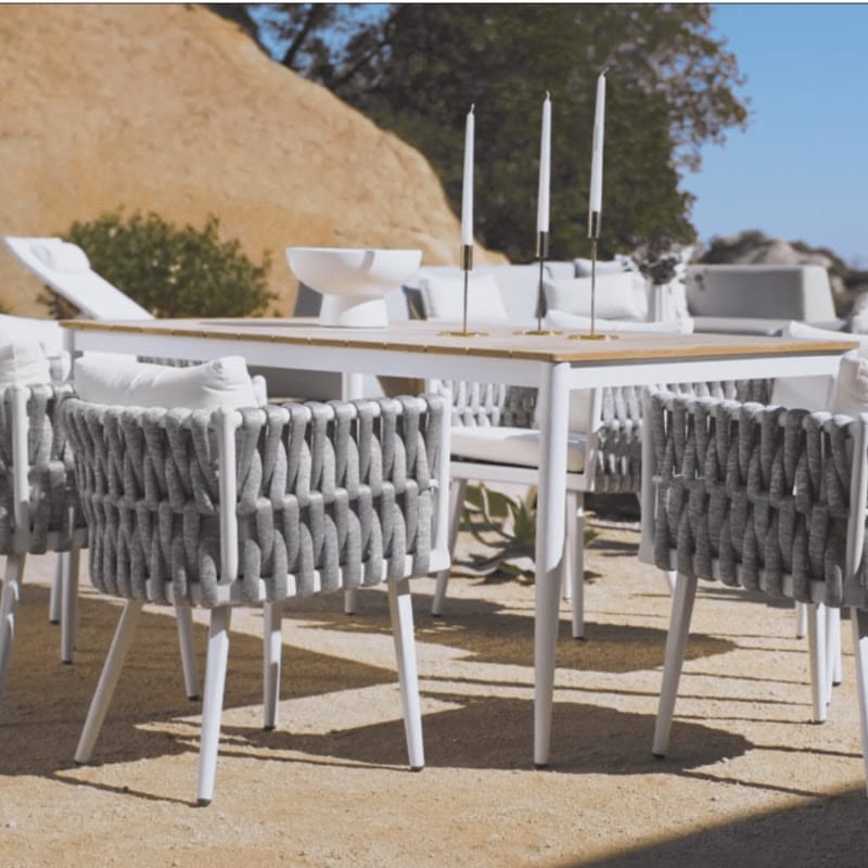 White Spencer Outdoor Dining Table With Candles On The Surface