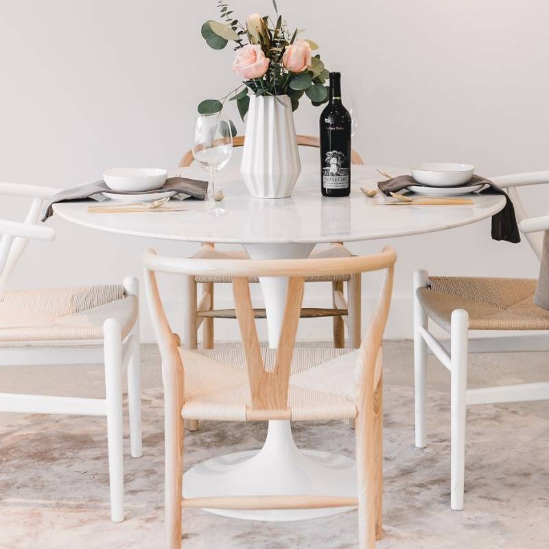 Four Wishbone Chairs in Natural Seat Cord at a Dining Table