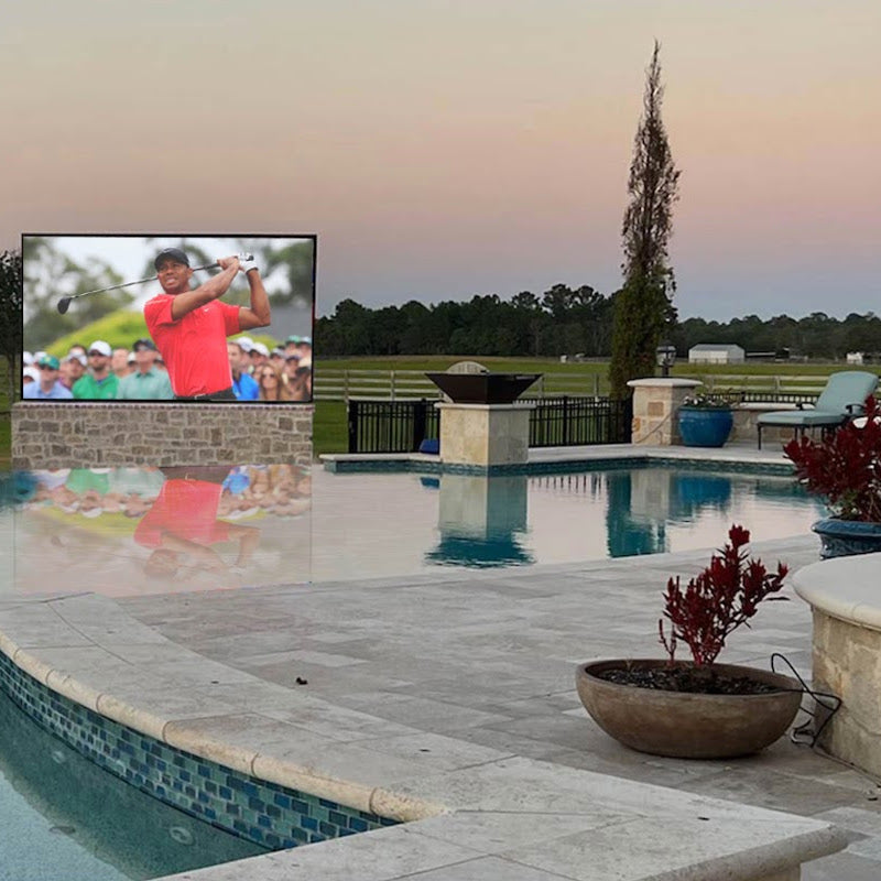 YOLO Outdoor Ground Mounted TV Next to Pool In Backyard of Ranch