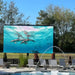 YOLO Outdoor Pole Mounted TV Next to Pool With a Fountain