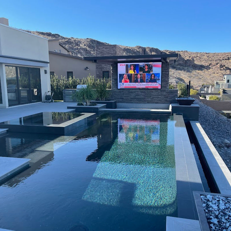 Yolo Outdoor TV Wall Mounted at The Far End of a Pool