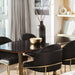 Four Angelo Dining Chairs in Trento Jet Black Fabric and Brass Base at Dining Table With Black Vase on Top