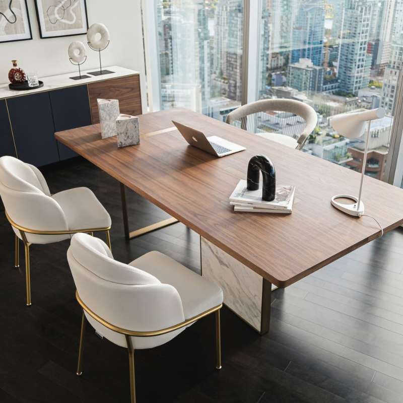 Six Angelo Dining Chairs in Pearl Fabric and Brass Base at an Office Desk Next to Window Overlooking the City