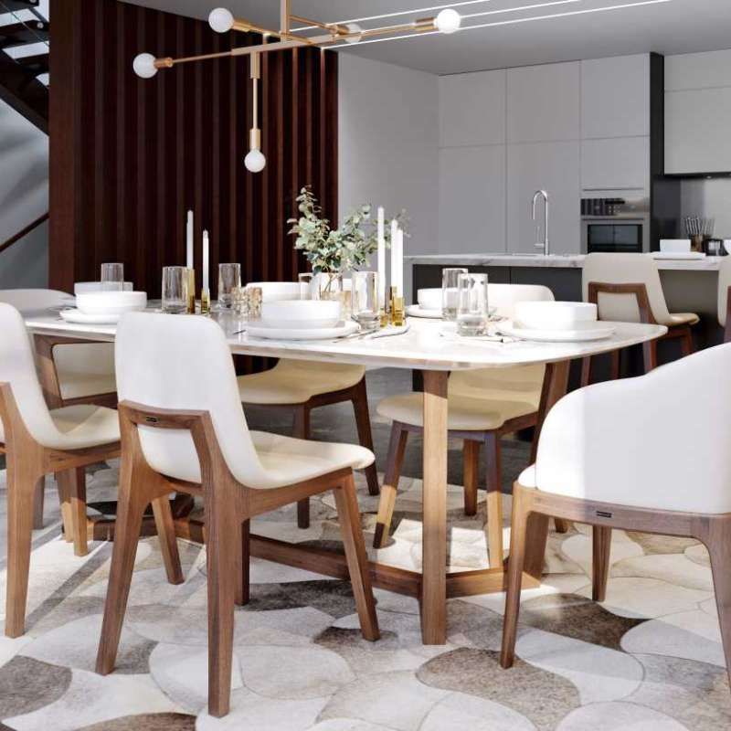 Angled View of The Evelyn Dining Table in White Carrara Marble in a Kitchen Dining Area