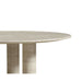 Close Up View of The Maximus Round Table With a White Travertine Surface