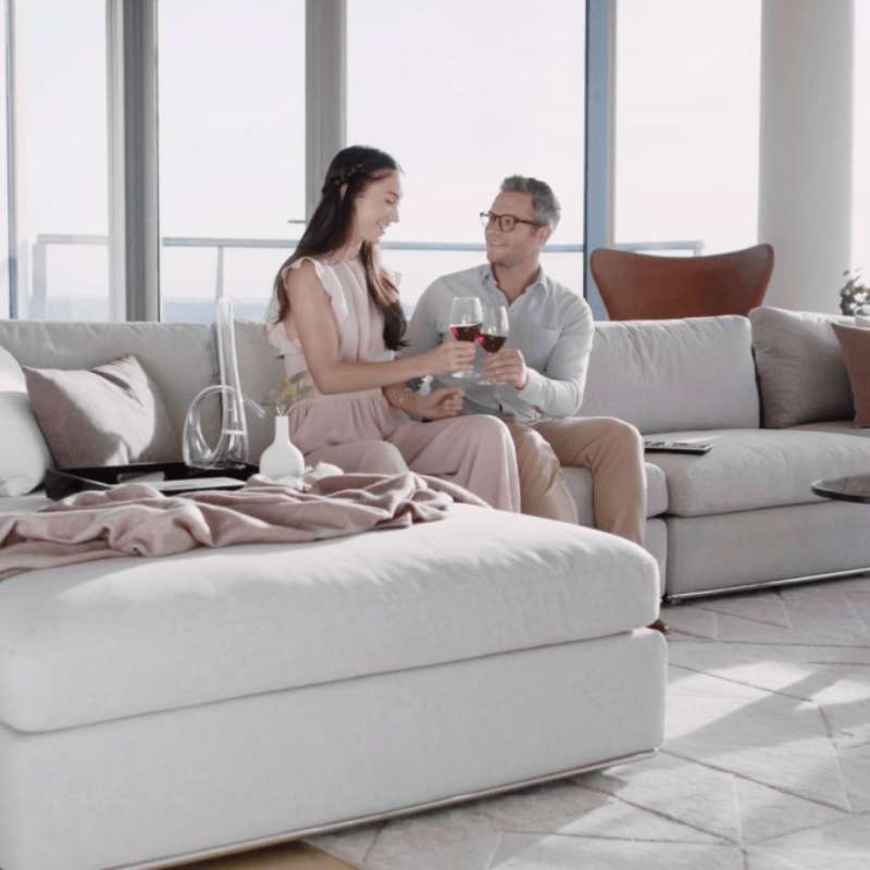 Couple Sitting on The Milo Sofa in a Living Room