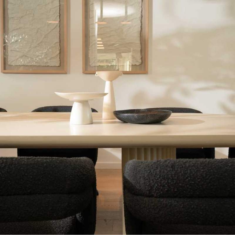 Close Up Front Facing View of The Osten Table in Alabaster Matte Lacquer Finish and Alabaster Concrete Base in a Dining Room