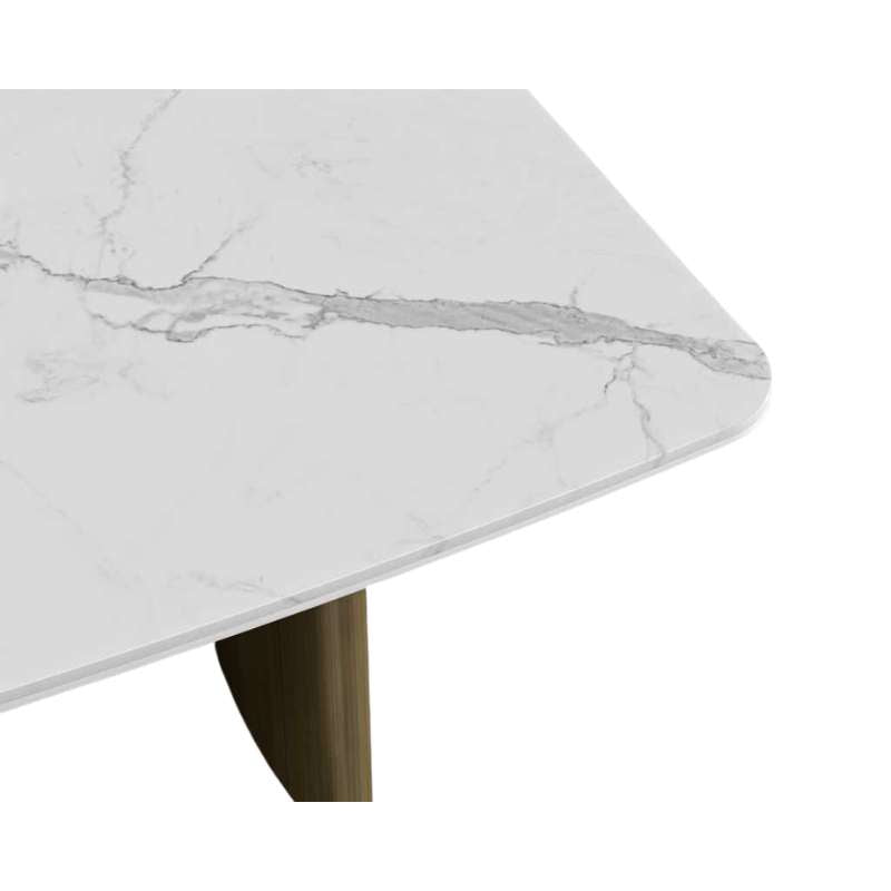 Close Up View of The Solana Dining Table With a White Calacatta Ceramic Surface and Antique Brushed Brass Base