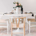 The Tulip Table Round With White Carrara Marble Surface and White Base With Table Setting