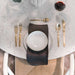 Top View of of Table Setting on The Tulip Table Round With White Carrara Marble Surface and White Base