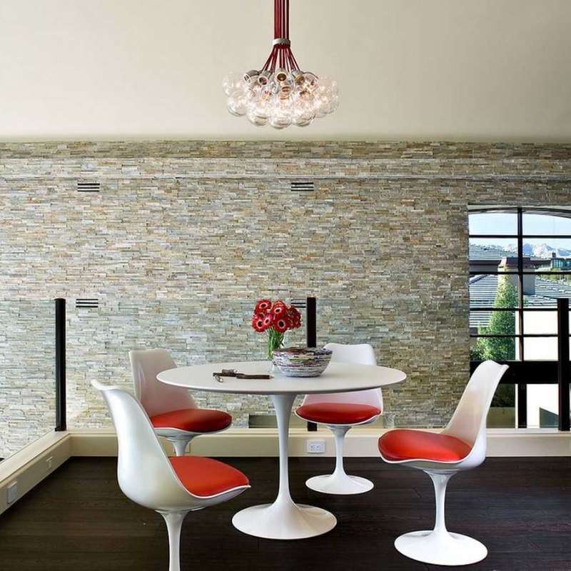 Front Facing View of The Tulip Table Round in White Lacquer Surface and White Base in a Dining Area